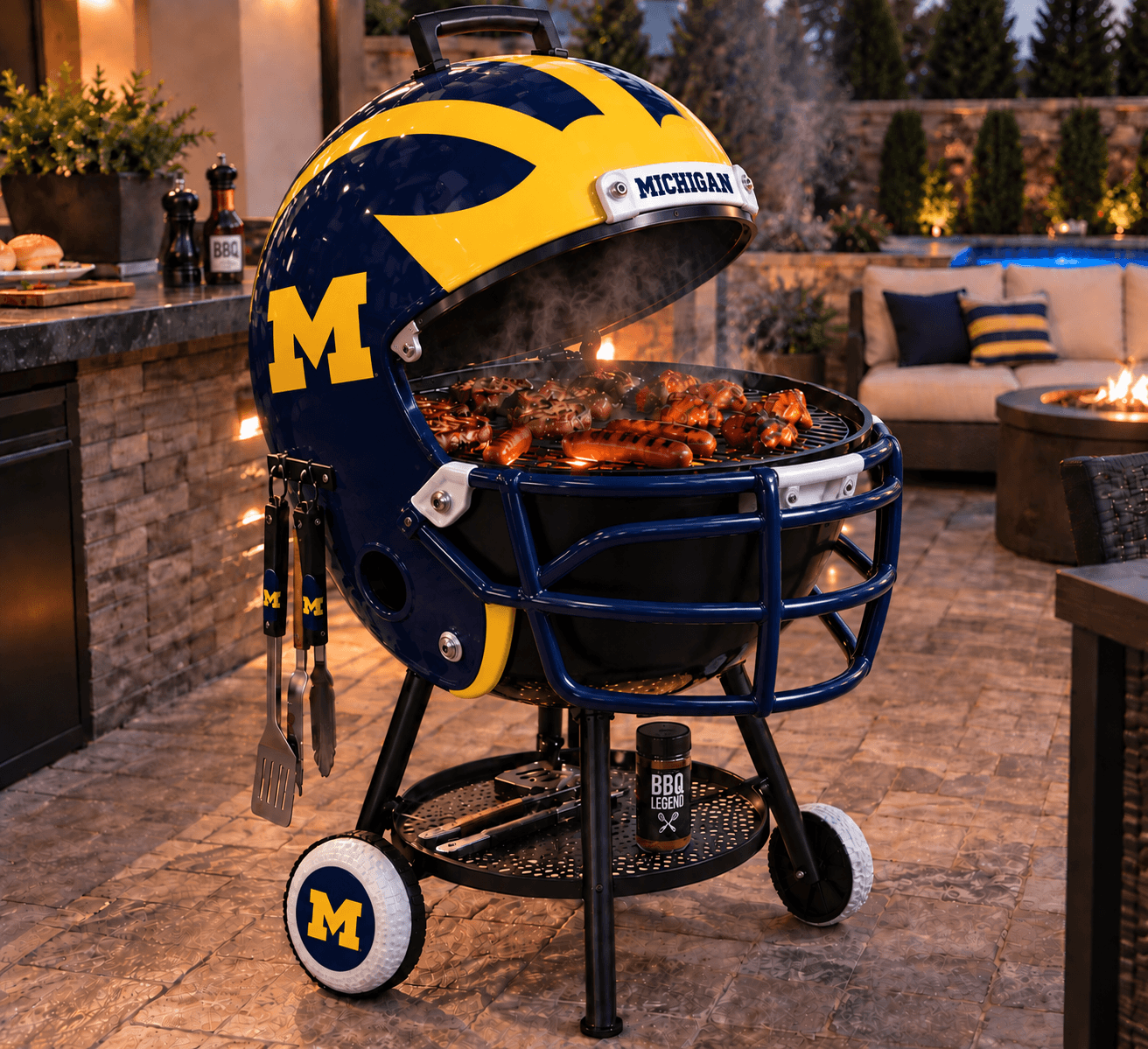 Michigan helmet-shaped grill pictured on a patio with its lid raised.